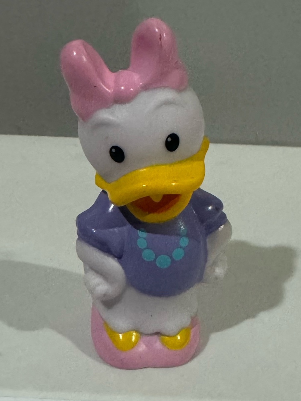 Disney Daisy Duck Figurine - Pink Bow, Purple Dress, Yellow Beak